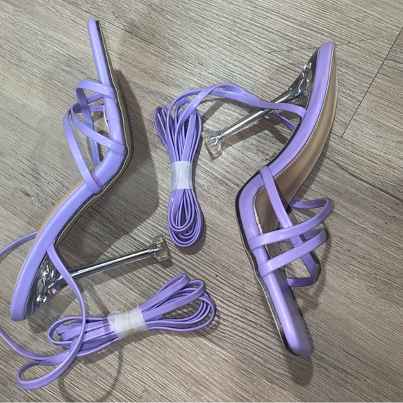 Purple heels with a clear bottom (never worn) and they are a size 6. - Picture 2 of 2